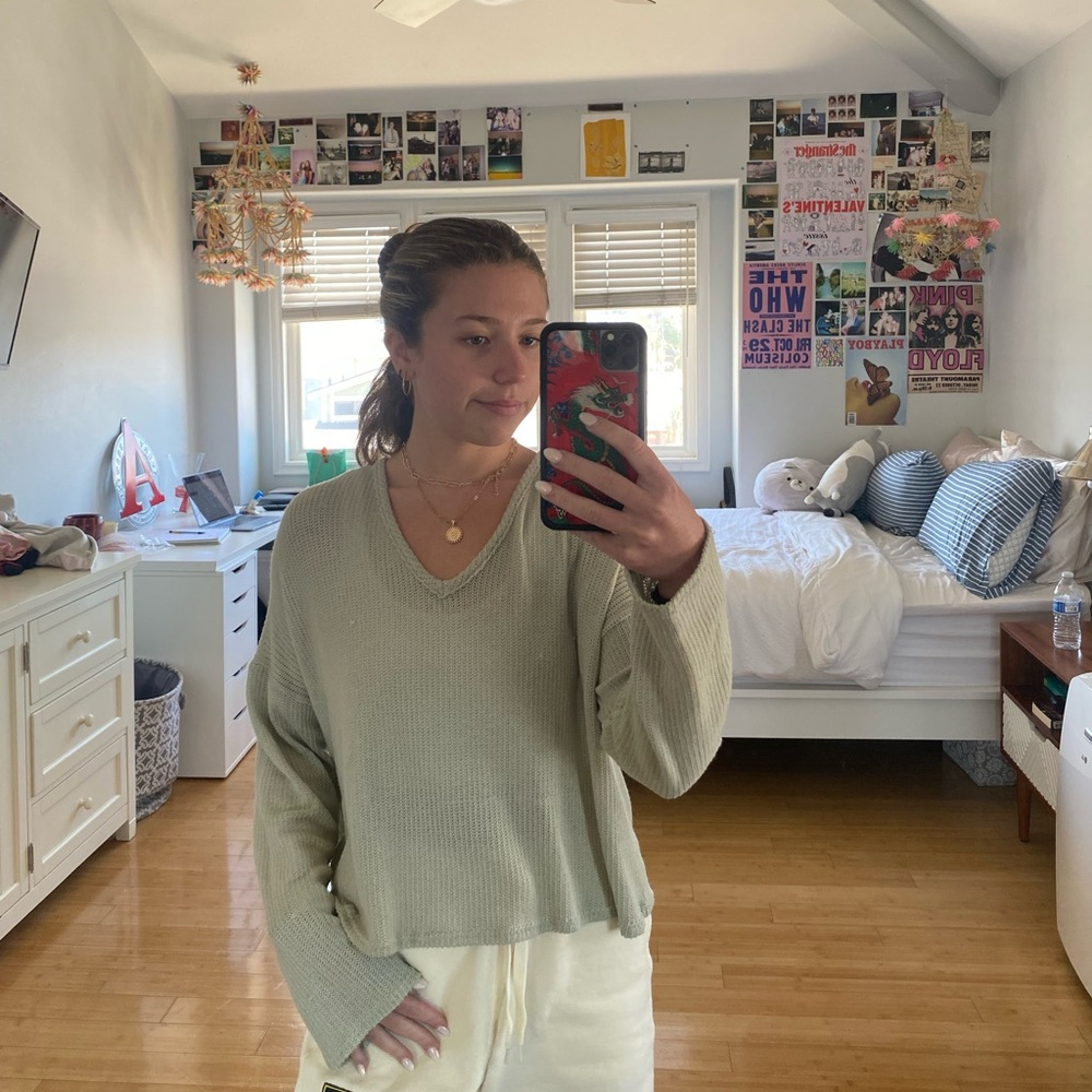 green sweater with tie up back